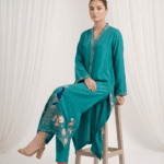 Resham work sleeves on peacock blue sheesha silk suit