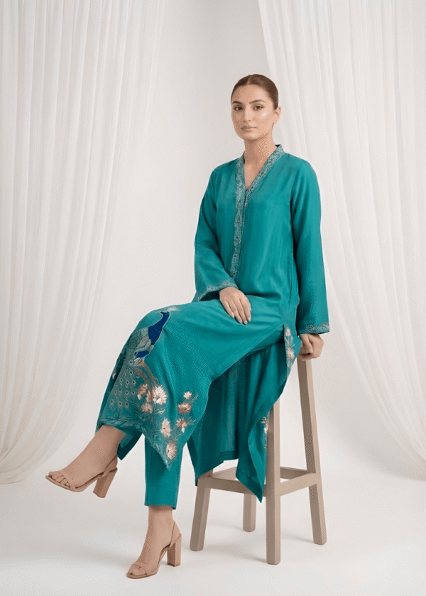 Resham work sleeves on peacock blue sheesha silk suit
