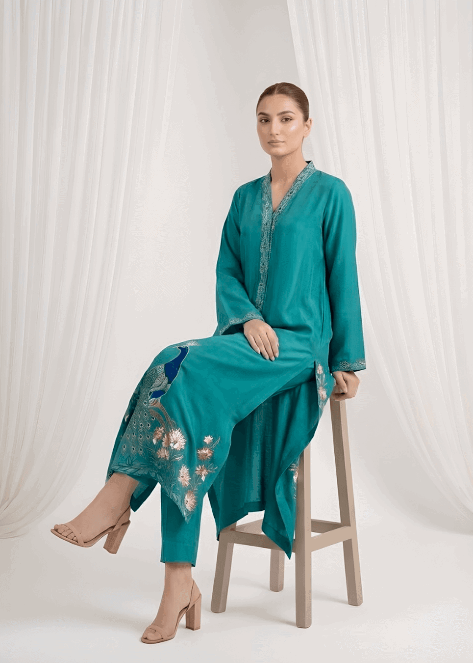 Resham work sleeves on peacock blue sheesha silk suit